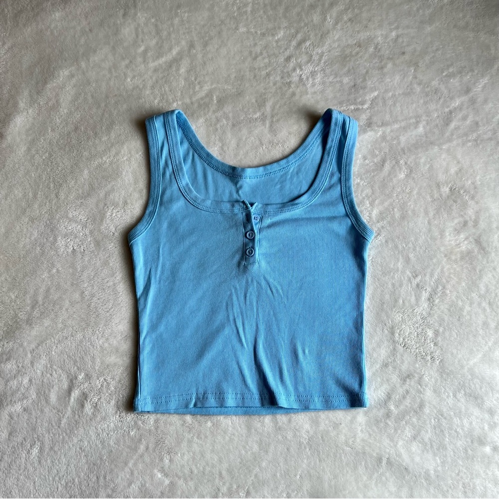 Tight fitting crop top, color light blue, size small